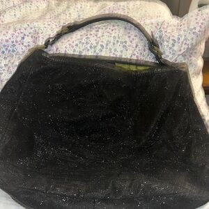 Oryany hobo bag studded, gently used bag. Repairable tear on one inside pocket